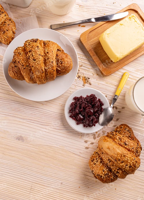 Fresh Baked Croissants with Butter and Cherry Jam