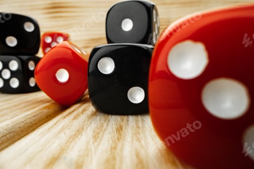 Preview: Red and black dice cubes on wooden background