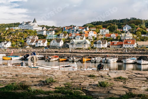 Preview: Boats moored in marina near small town