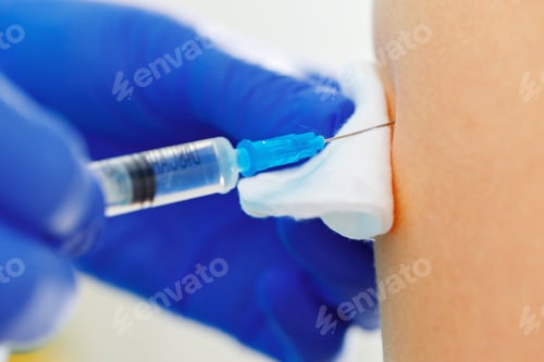 Preview: Doctor hands making a vaccination in the shoulder of patient