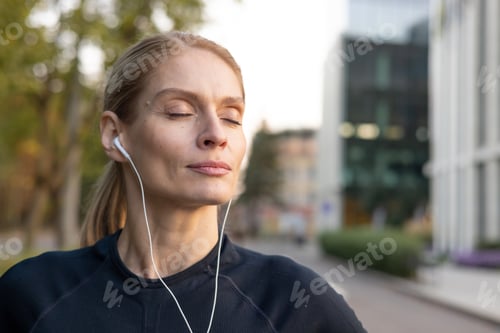Preview: Active woman enjoying a jog in the city during golden hour