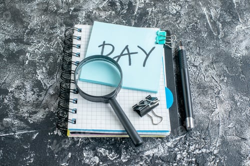 Preview: front view day written note with copybook and pen on gray background team color job office work