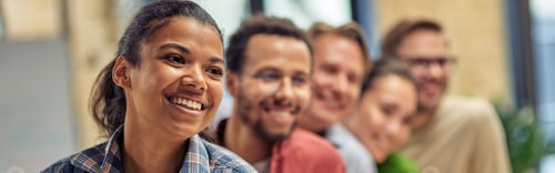 Preview: Successful startup team. Group of young happy multiethnic colleagues smiling while posing in the