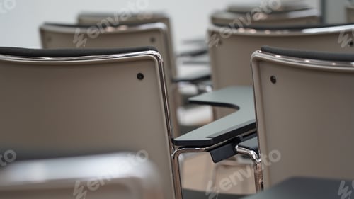 Preview: Closeup of an empty audience modern metal chairs indoors