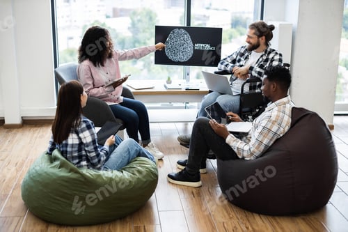 Preview: Team discussing artificial intelligence project in modern creative office space
