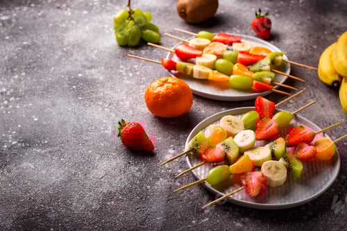 Preview: Colorful Fruit Skewers on Gray Surface