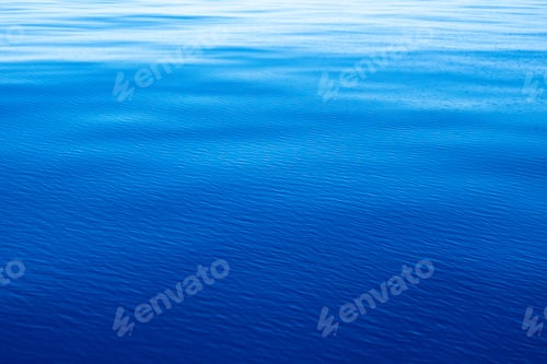 Preview: Sea water surface calm with small ripples. Still ocean, deep blue color background,