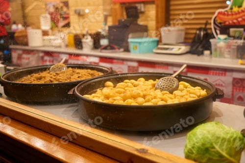 Preview: Traditional street food with fried potatoes at Christmas market