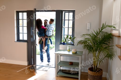 Preview: Happy african american children welcoming their father coming back home