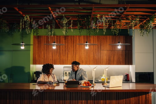Preview: Diverse colleagues at eco friendly office working on sustainable project