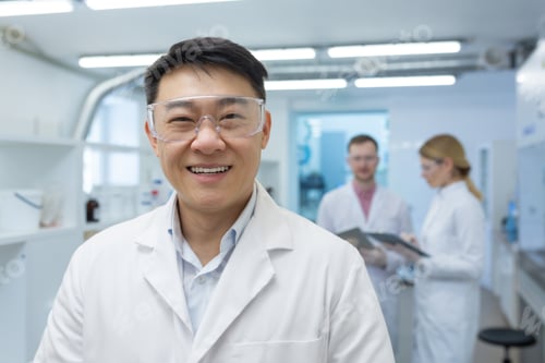 Preview: Portrait of an Asian laboratory technician scientist inside a laboratory, the man is looking at the