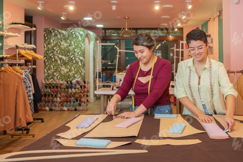 Preview: Happy women working together in a sewing workshop