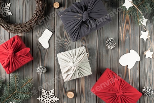Preview: Christmas festive holiday composition Furoshiki present boxes with decorated spruce branches