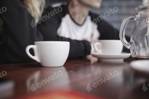 Preview: Coffee at a Cafe on a Wooden Table