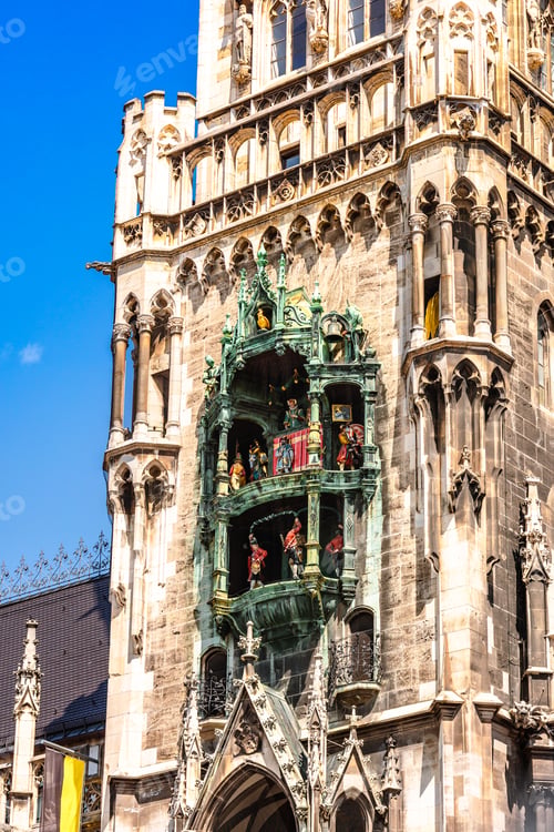 Preview: Panoramic view of theatrical puppet show on tower in Marienplatz town hall of Marien Square in