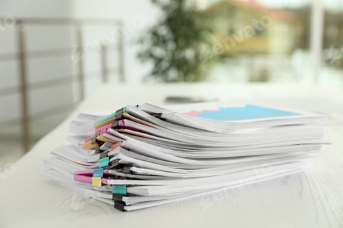 Preview: Stack of documents with paper clips on office table. Space for text