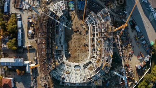 Preview: Top view of stadium construction in city. Stock footage. Construction of modern sports stadium