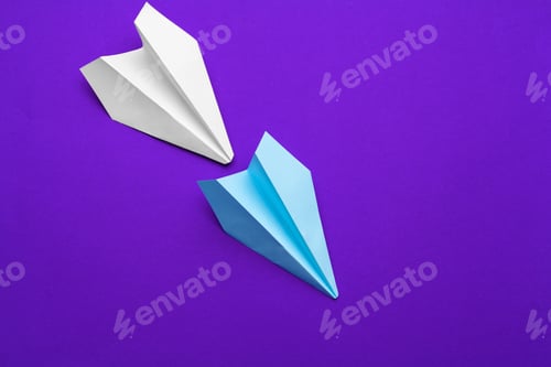Preview: white paper airplane on a purple background