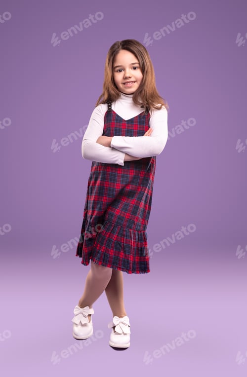 Preview: Confident schoolgirl in uniform in studio