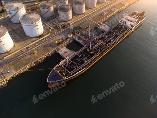 Preview: Aerial view of oil ship tanker and lpg ship at industrial port at sunset
