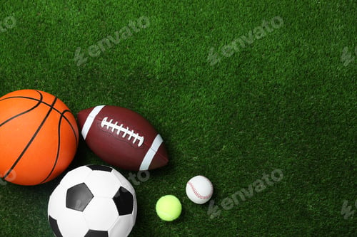 Preview: Set of different sport balls on green grass, flat lay. Space for text