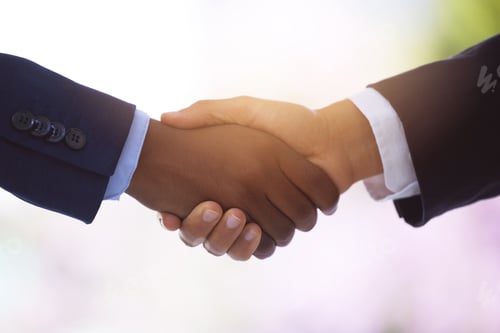 Preview: Shot of two unrecognizable businessmen shaking hands against a blurry background