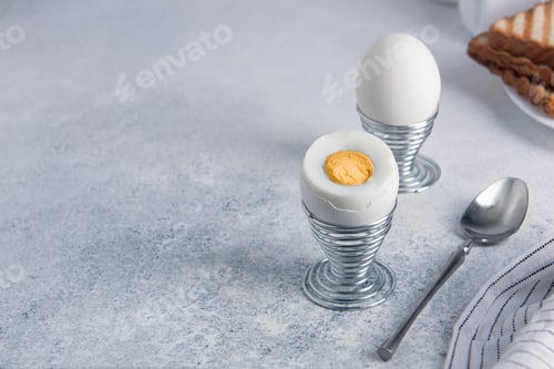 Preview: Breakfast of two hard-boiled eggs and toast.