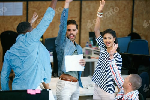 Preview: Shout out to the best team ever. Shot of a team of colleagues celebrating in a modern office.