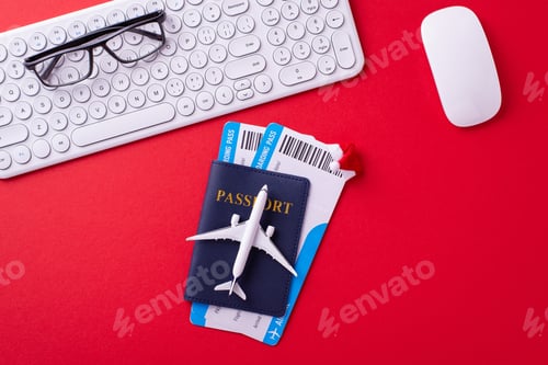 Preview: A flat lay of travel essentials including a passport, boarding pass