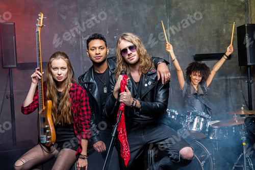 Preview: rock band posing in studio after rehearse
