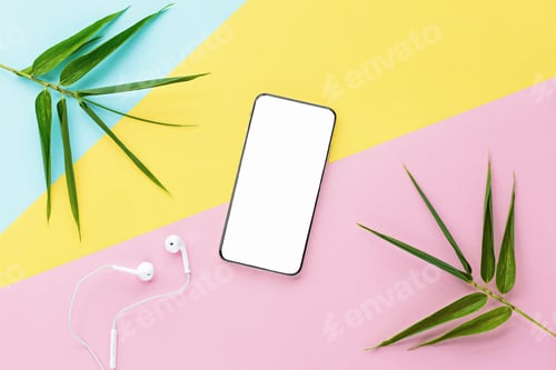 Preview: Flat lay of mobile phone with white screen and headphones on colorful background with copy space