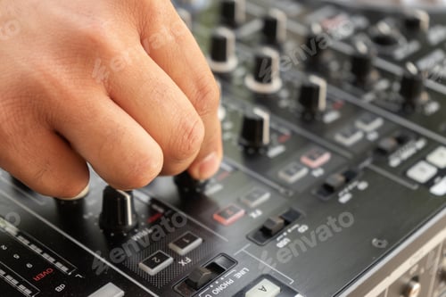 Preview: DJ Hands creating and regulating music on dj console mixer in concert party outdoor openair
