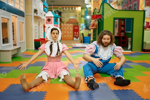 Preview: Funny comic man and woman sitting on playroom floor