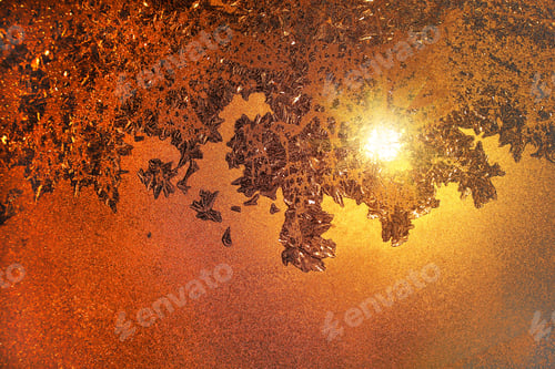 Preview: Ice pattern and sunlight on morning winter glass