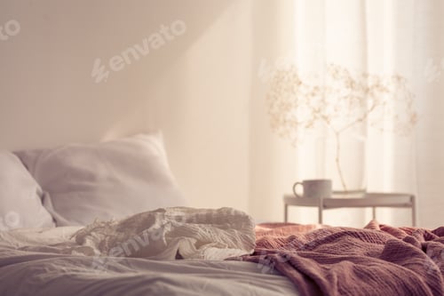 Preview: Red blanket on bed with pillows in white minimal bedroom interio