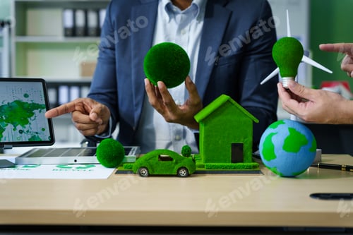 Preview: A meeting at an office desk focuses on teamwork with a house model and discussions on electric cars