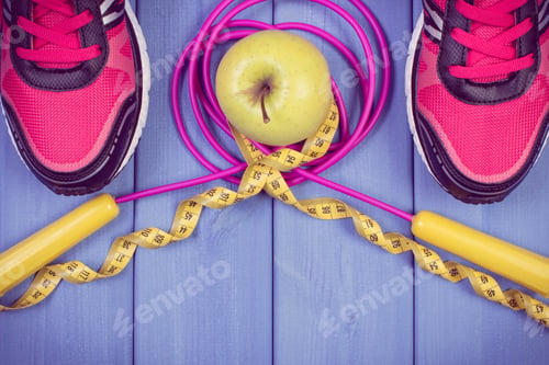 Preview: Sport shoes, accessories for fitness and fresh apple. Healthy sporty lifestyles