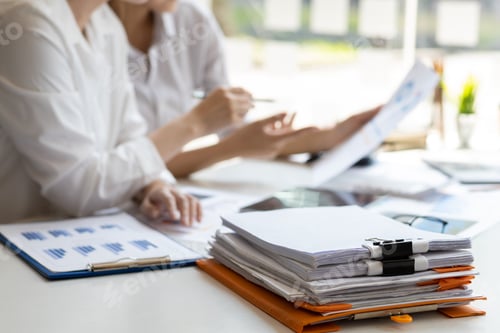Preview: Colleagues businesswoman discussing business project project documents in office.
