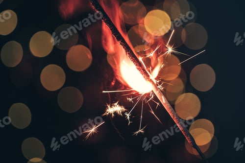 Preview: Red bengal sparkle lights close up on dark background