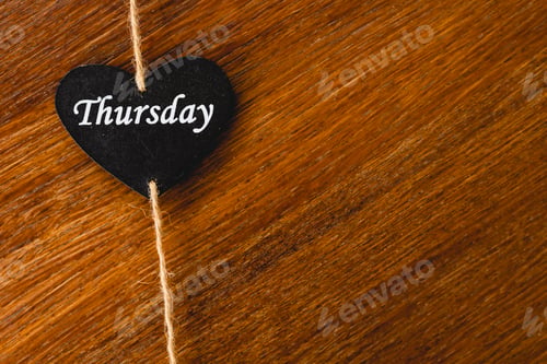 Preview: Black wooden heart with day of the week written on it, Thursday