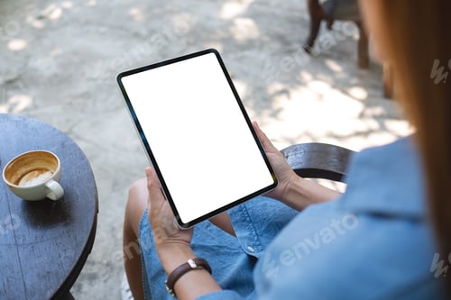 Preview: Mockup image of a woman holding digital tablet with blank white desktop screen in the outdoors