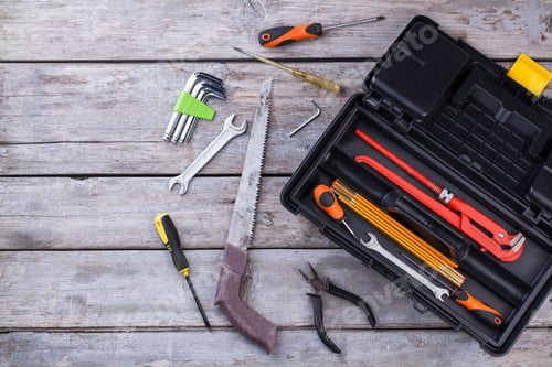 Preview: Top view of different working tools on wooden background.