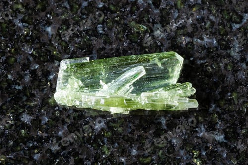 Preview: sample of unpolished zoisite crystals on black