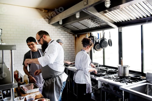 Preview: Group of chefs working in the kitchen