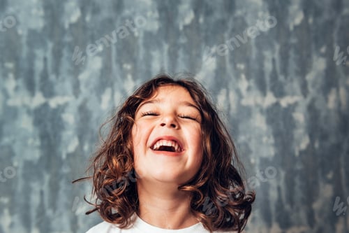 Preview: portrait of a happy little girl laughing
