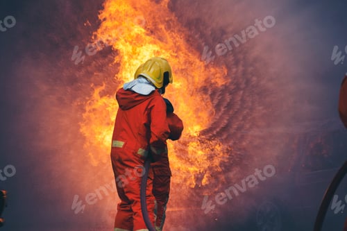Preview: Firefighter Rescue training in fire fighting extinguisher. Firefighter fighting with flame fire
