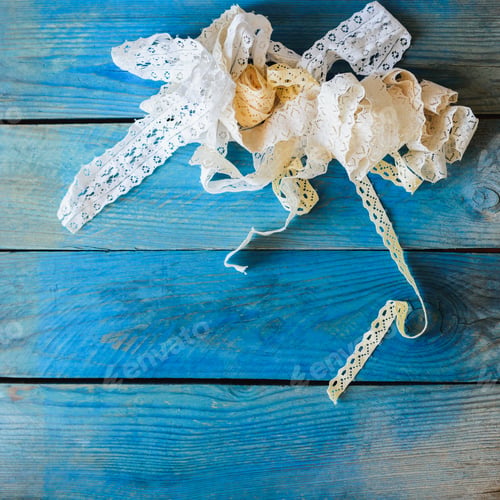 Preview: crafts concept, lace ribbon on wooden background