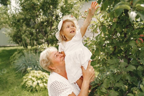 Preview: Grandmother and granddaughter enjoyed in the garden