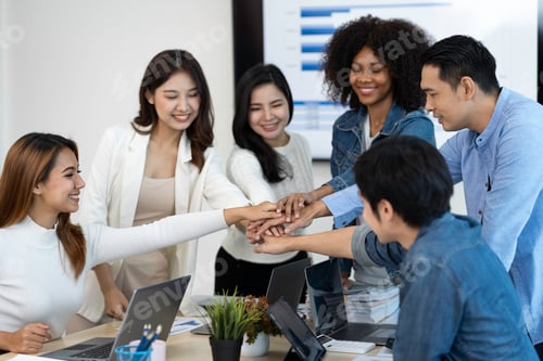 Preview: business team celebrates corporate victory together in the office, happy overjoyed professionals gro