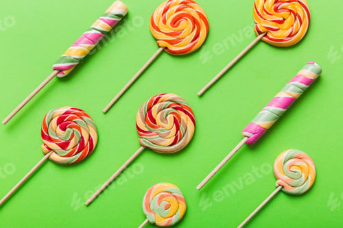 Preview: Set of colorful lollipops on colored background.